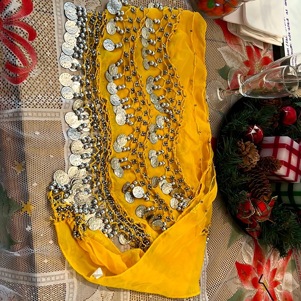 Belly dance wave shape hip scarf with silver coins. Yellow.